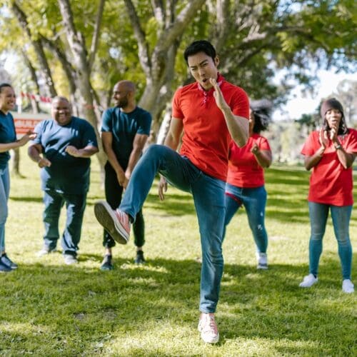 Adults in park being active