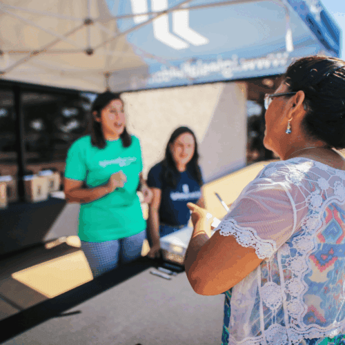 Health advocates speaking with community members